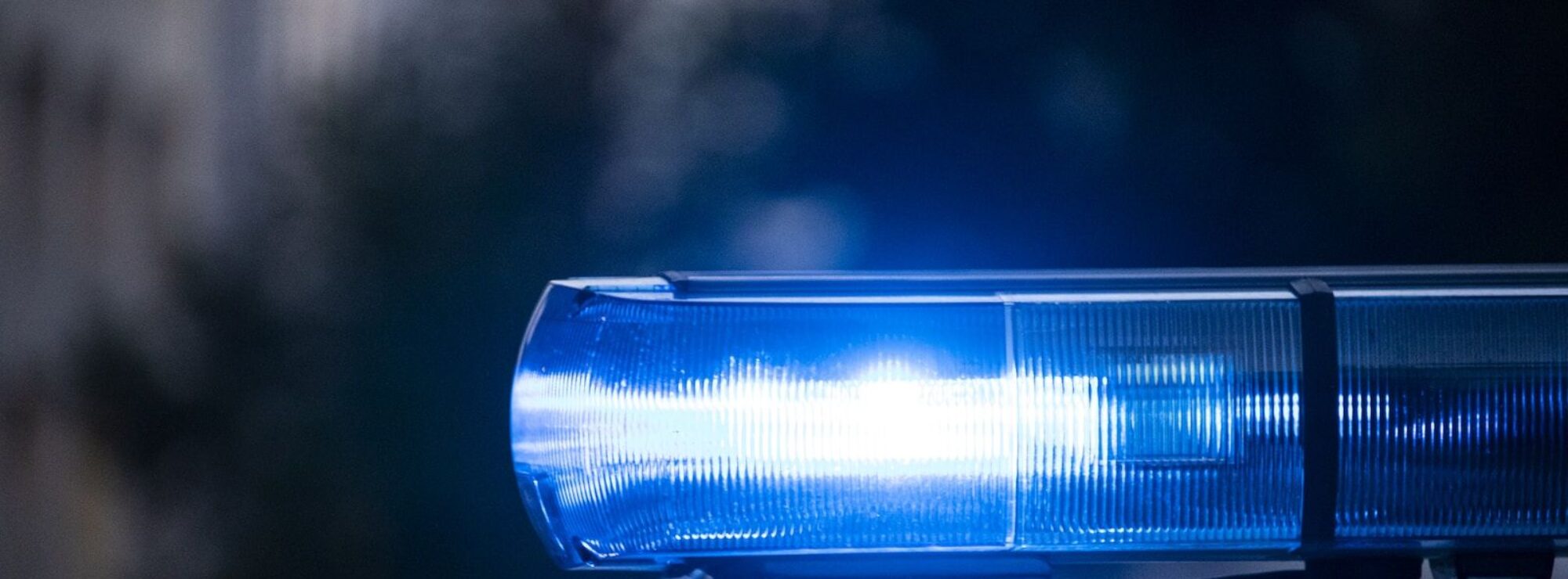 a close up of a police car with its lights on